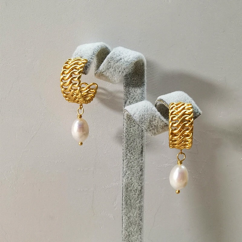 Gold tone half hoop earrings with pearl