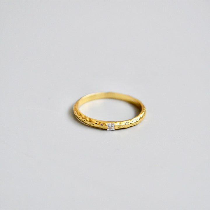 single zirconia gold tone ring in Hammered