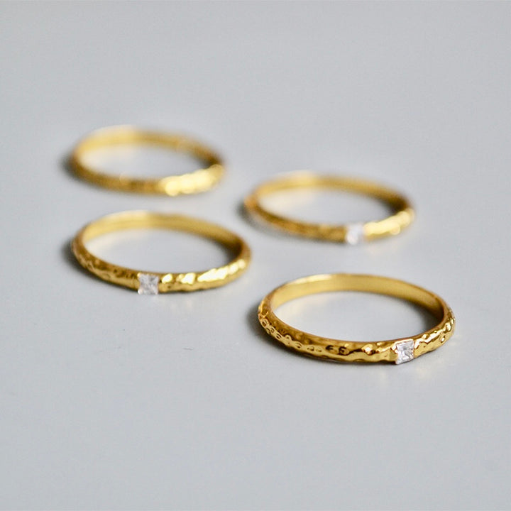 single zirconia gold tone ring in Hammered