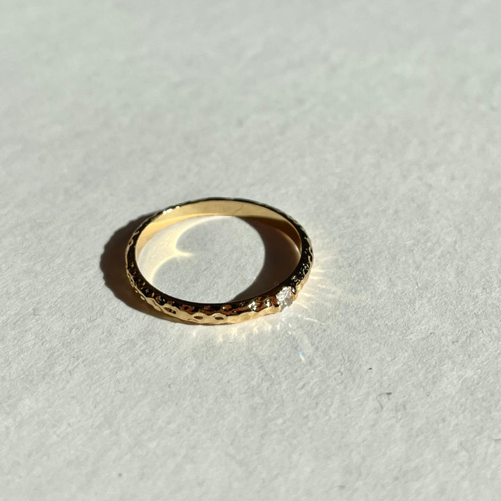 single zirconia gold tone ring in Hammered